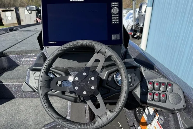 Slide: The Image of Steering console of 2026 Skeeter ZXE21 boat with advanced controls and display. - 12