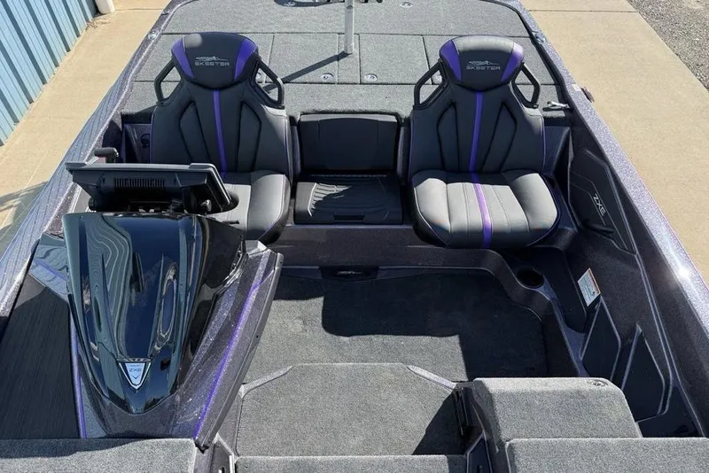 Slide: The Image of 2026 Skeeter ZXE21 boat interior with dual seats and modern dashboard. - 15