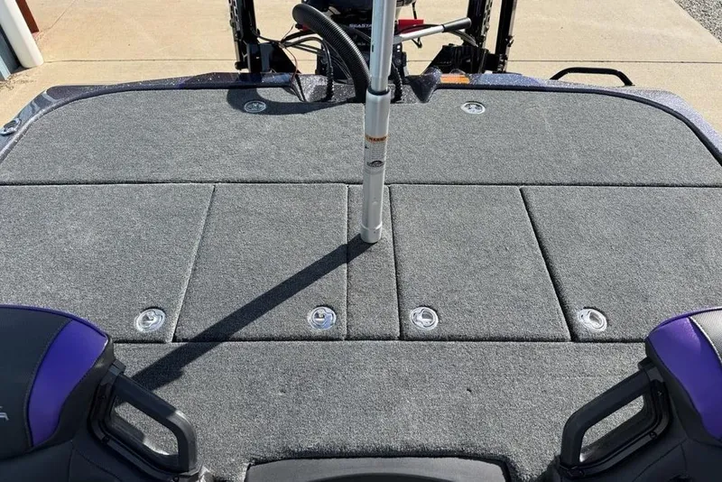 Slide: The Image of 2026 Skeeter ZXE21 boat deck with gray carpet and storage compartments. - 18