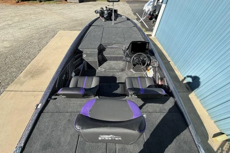 Slide: The Image of 2026 Skeeter ZXE21 boat interior with modern dashboard and seating. - 22