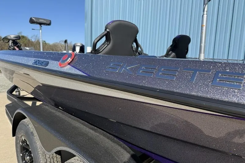 Slide: The Image of 2026 Skeeter ZXE21 boat with sleek design and metallic finish. - 6