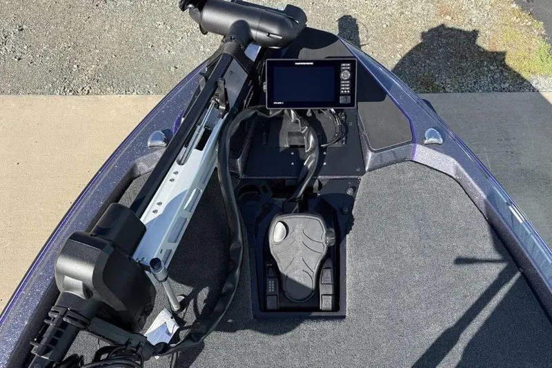 Slide: The Image of 2026 Skeeter ZXE21 boat dashboard with advanced navigation system and foot pedal controls. - 7