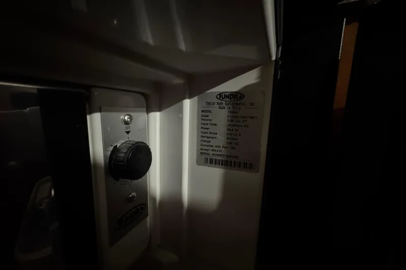 Slide: The Image of Control panel and label inside a 1974 Bertram 31 Flybridge Cruiser. - 29