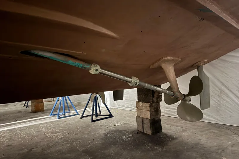 Slide: The Image of 1974 Bertram 31 Flybridge Cruiser underside with propeller and shaft detail. - 34