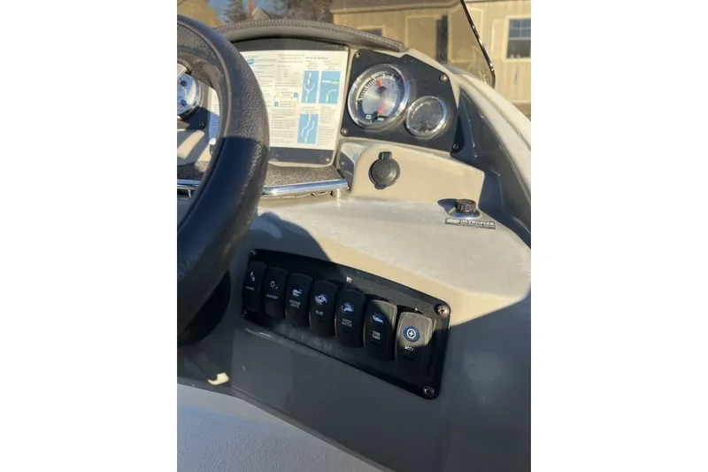 Slide: The Image of 2016 Stingray 192 SC boat dashboard with steering wheel and control switches. - 10