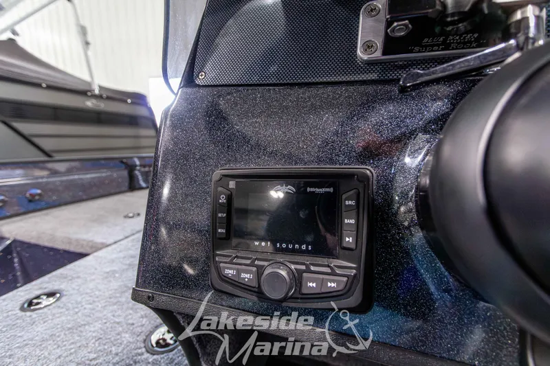 Slide: The Image of 2026 Recon 895 SC boat dashboard with audio system at Lakeside Marina. - 21