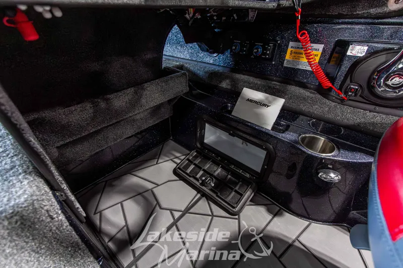 Slide: The Image of Interior of 2026 Recon 895 SC boat with Mercury controls and modern dashboard. - 22