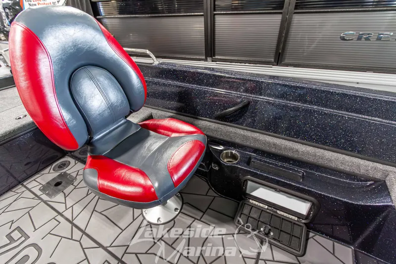 Slide: The Image of Red and black seat in 2026 Recon 895 SC boat interior. - 23