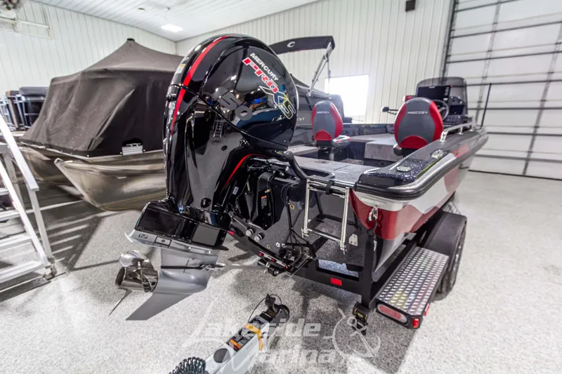 Slide: The Image of 2026 Recon 895 SC boat with Mercury Pro XS engine in a showroom. - 4