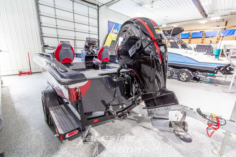 Slide: The Image of 2026 Recon 895 SC boat with powerful 150 HP engine in showroom. - 6