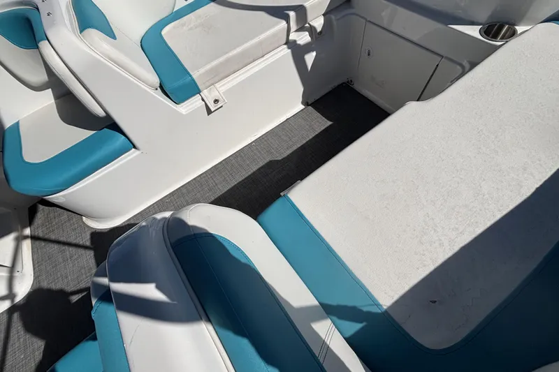 Slide: The Image of 2021 Bayliner Element E18 boat interior with blue and white seating. - 13