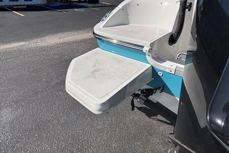 Slide: The Image of 2021 Bayliner Element E18 boat swim platform on asphalt surface. - 16