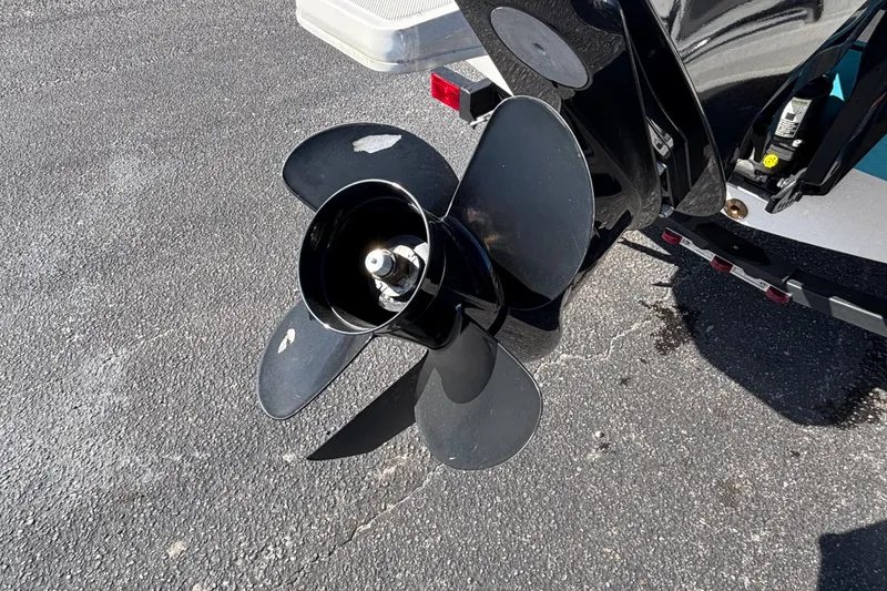 Slide: The Image of 2021 Bayliner Element E18 boat propeller on asphalt surface. - 17
