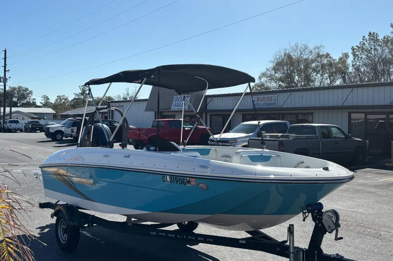 Slide: The Image of 2021 Bayliner Element E18 boat on trailer in parking lot, sunny day. - 5