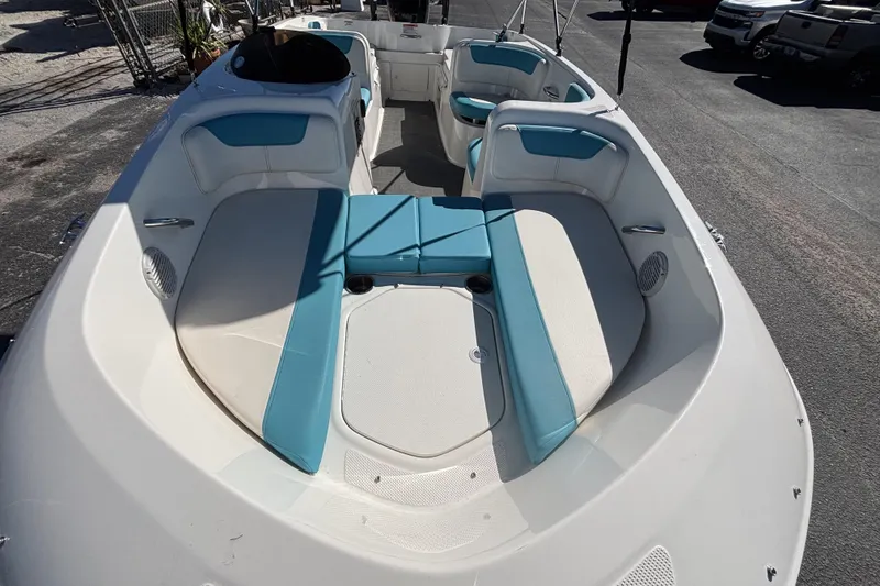 Slide: The Image of 2021 Bayliner Element E18 boat interior with blue and white seating. - 9