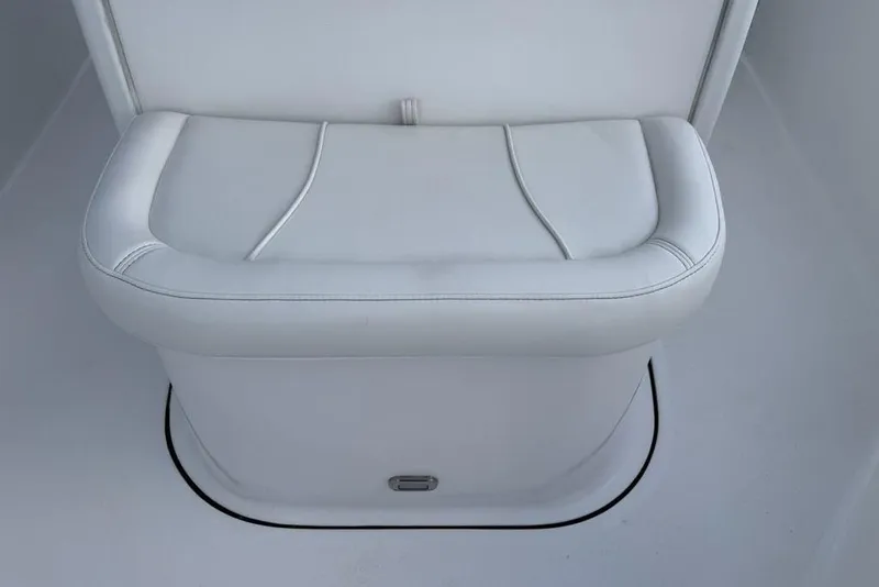 Slide: The Image of White cushioned seat on 2026 Tidewater 232 LXF boat interior. - 15