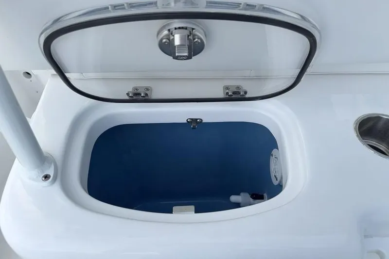 Slide: The Image of Open storage compartment on 2026 Tidewater 232 LXF boat, featuring a sleek design. - 26