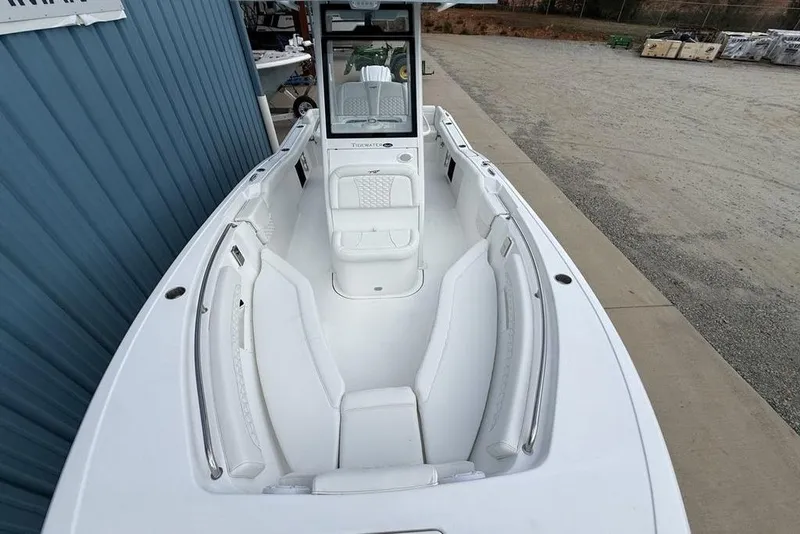 Slide: The Image of 2026 Tidewater 232 LXF boat with sleek white interior and spacious seating. - 35