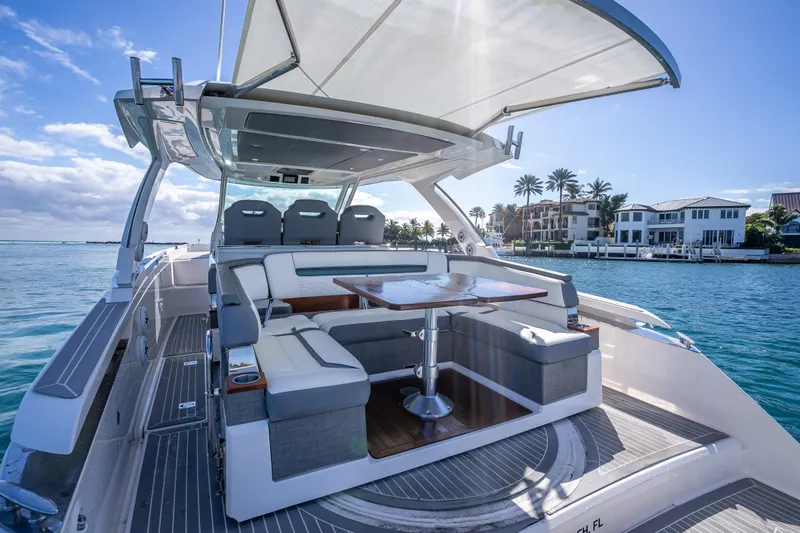 Slide: The Image of 2019 Tiara Sport 38 LS luxury yacht with spacious seating and elegant design on the water. - 10
