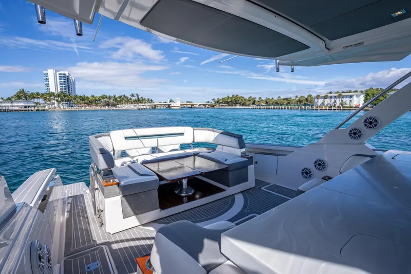 Slide: The Image of Luxurious 2019 Tiara Sport 38 LS yacht interior with ocean view and modern seating. - 12