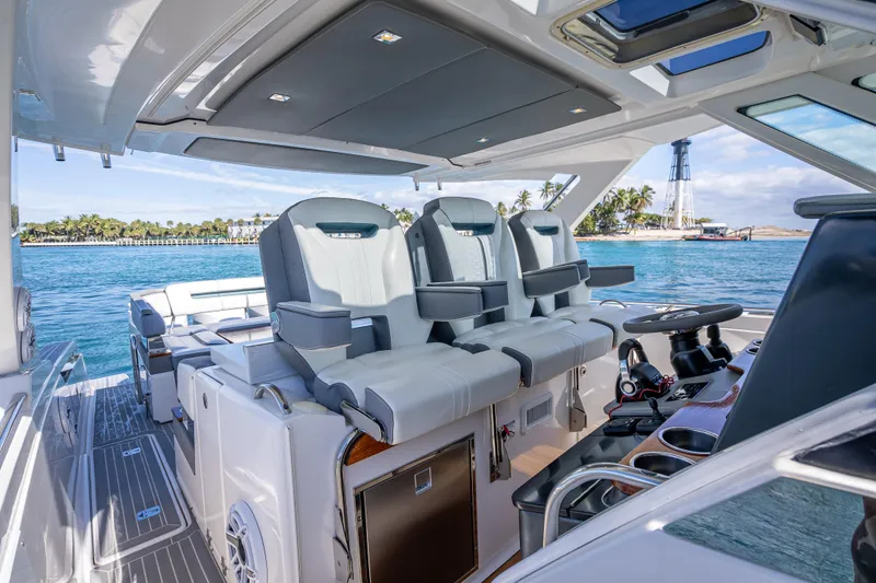 Slide: The Image of 2019 Tiara Sport 38 LS yacht interior with luxurious seating and ocean view. - 20