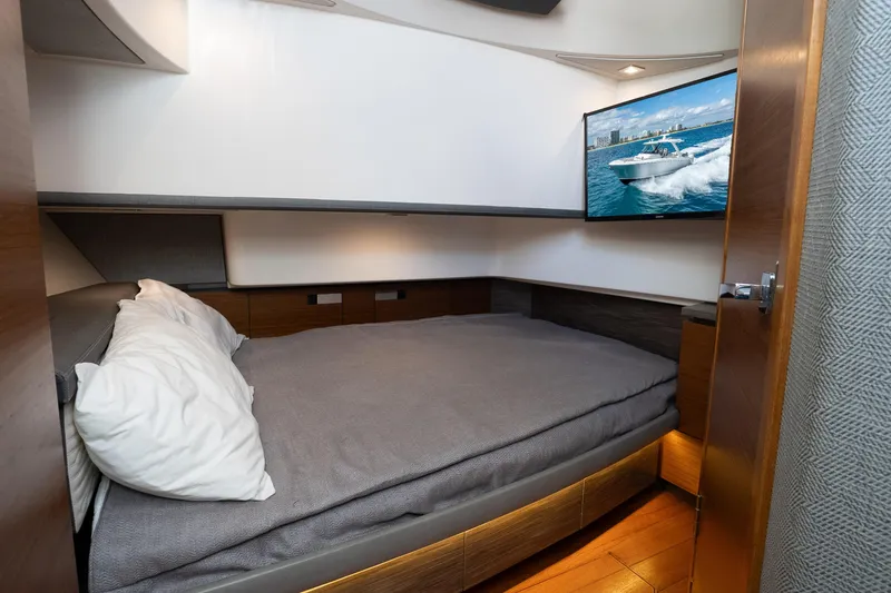 Slide: The Image of Interior cabin of 2019 Tiara Sport 38 LS with bed and wall-mounted TV. - 23