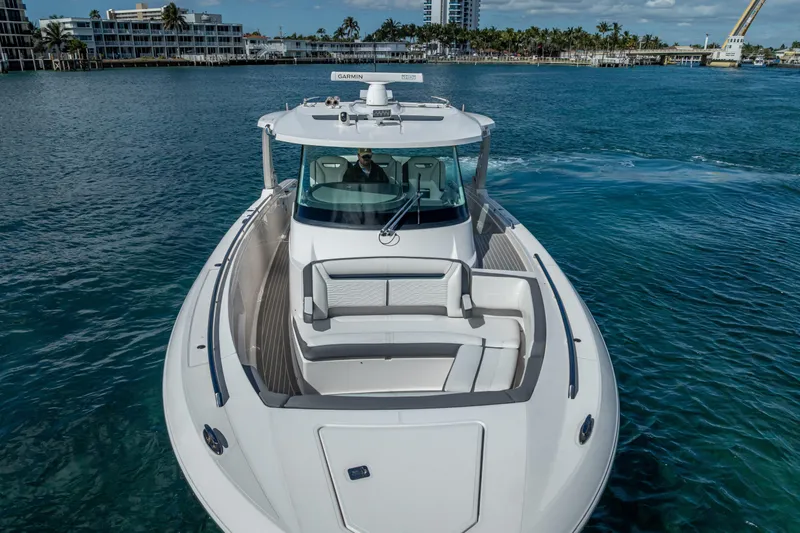 Slide: The Image of 2019 Tiara Sport 38 LS luxury boat cruising on clear blue water. - 7