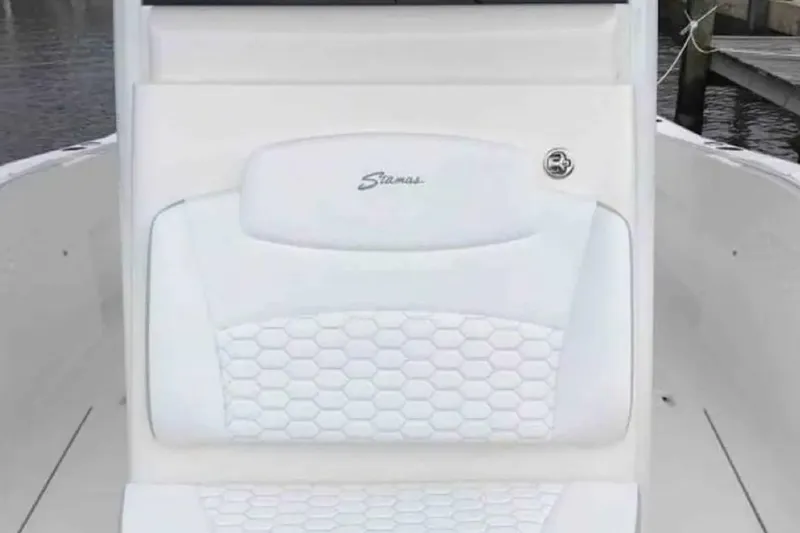 Slide: The Image of 2022 Stamas 31T Aventura boat seat with hexagonal pattern and logo. - 12