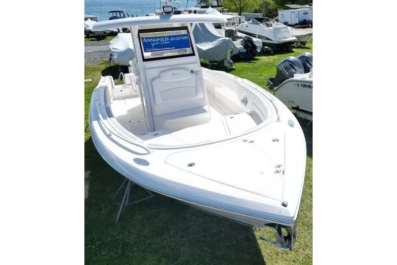 Slide: The Image of 2022 Stamas 31T Aventura boat displayed on grass near waterfront. - 3