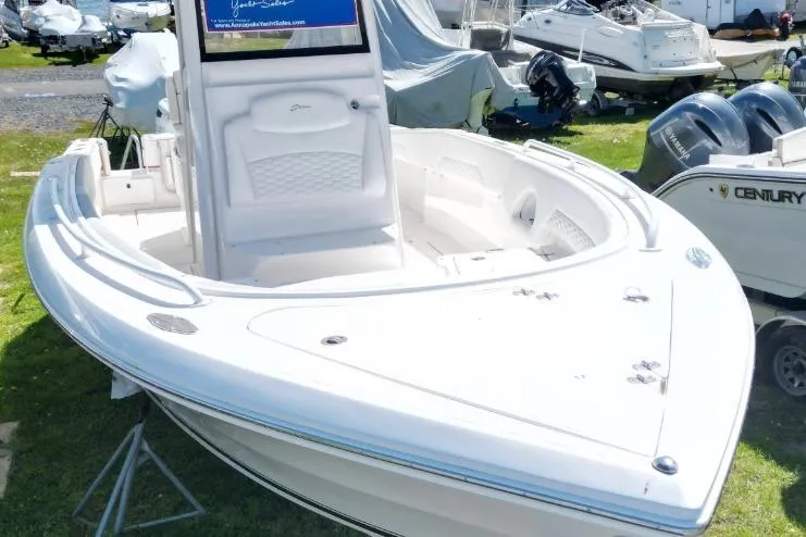 Slide: The Image of 2022 Stamas 31T Aventura boat displayed outdoors with twin engines. - 4