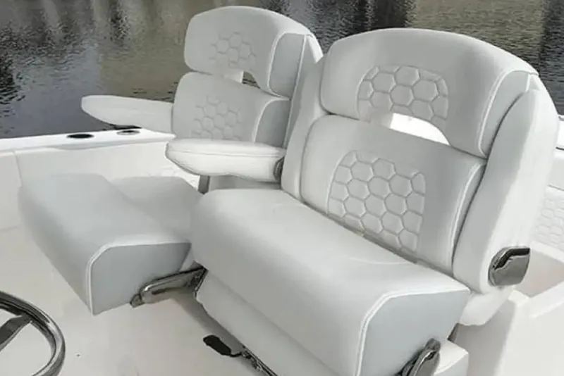Slide: The Image of 2022 Stamas 31T Aventura boat seats with hexagonal pattern, overlooking water. - 7