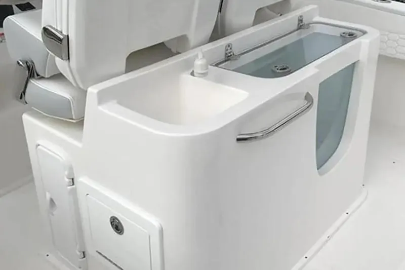 Slide: The Image of 2022 Stamas 31T Aventura boat interior with sink and storage compartments. - 9