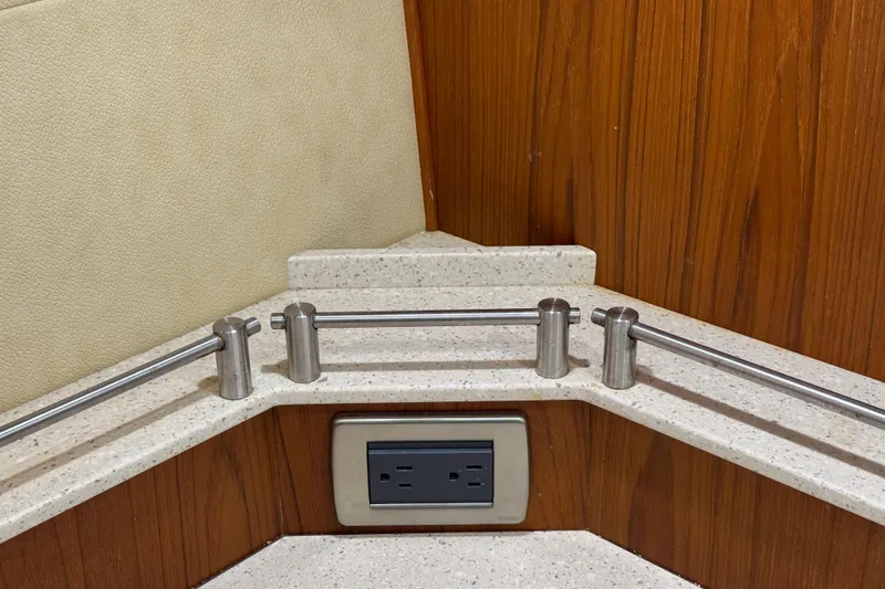 Slide: The Image of Interior detail of a 2007 Tiara 43 yacht, featuring a countertop and power outlet. - 19