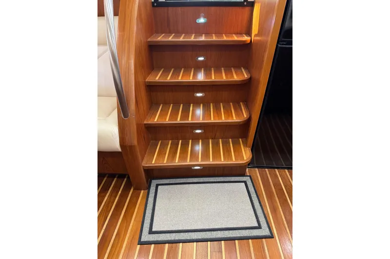 Slide: The Image of Wooden stairs with lighting on a 2007 Tiara 43 yacht interior. - 21