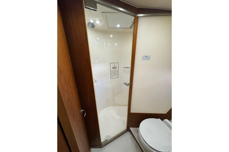 Slide: The Image of Bathroom interior of 2007 Tiara 43 yacht with glass shower door and modern fixtures. - 3