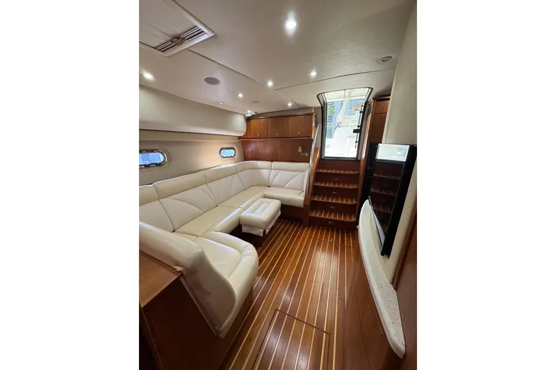Slide: The Image of Luxurious interior of 2007 Tiara 43 yacht with elegant seating and wooden flooring. - 36