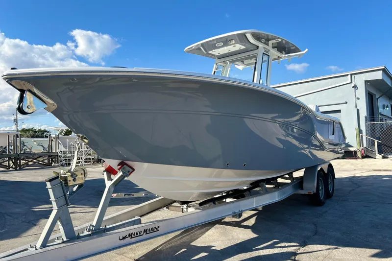 The Image of 2026 Sea Fox 268 Commander boat on trailer under clear blue sky. - 1