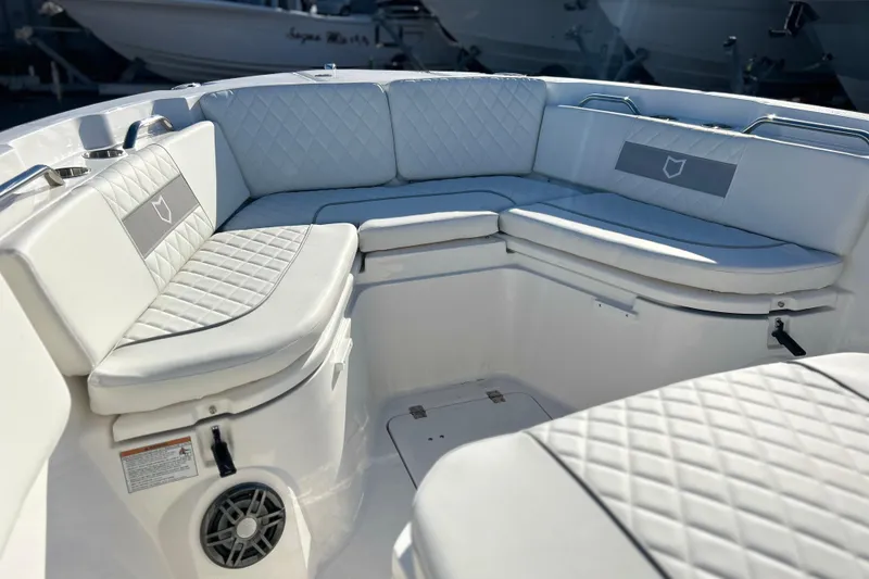 Slide: The Image of 2026 Sea Fox 268 Commander boat interior with white cushioned seating. - 11