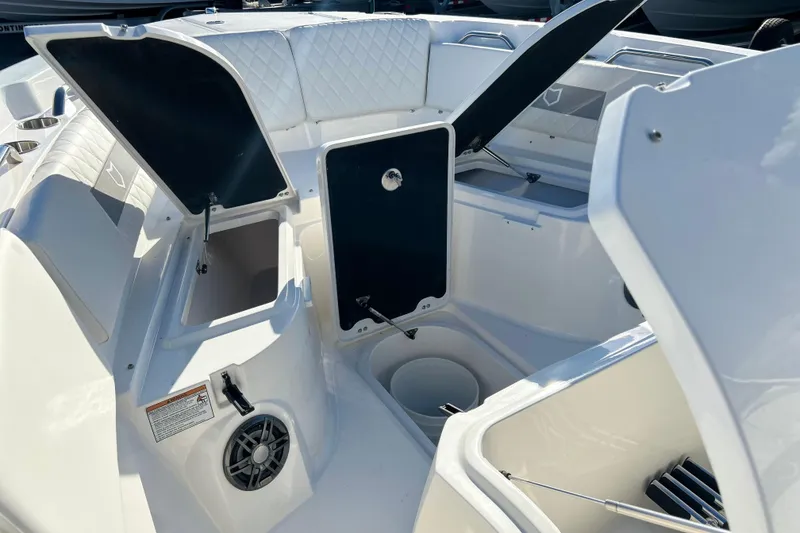 Slide: The Image of 2026 Sea Fox 268 Commander boat interior with open storage compartments and seating. - 17