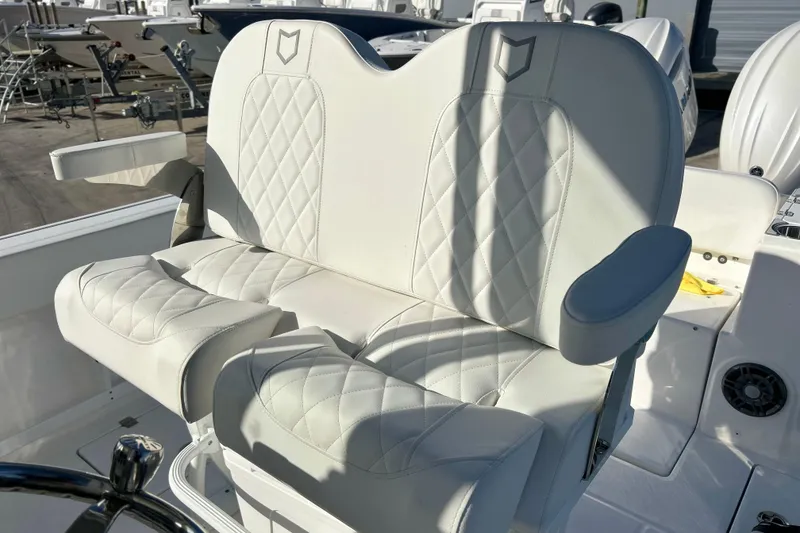 Slide: The Image of Luxurious seating on 2026 Sea Fox 268 Commander boat, featuring diamond-stitched white upholstery. - 20