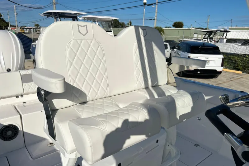 Slide: The Image of 2026 Sea Fox 268 Commander boat with white quilted seating and armrests. - 21