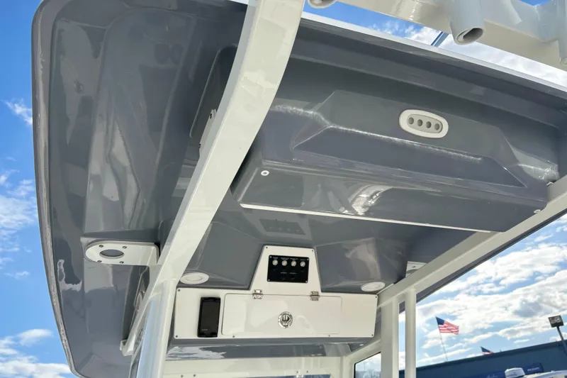 Slide: The Image of 2026 Sea Fox 268 Commander boat console under blue sky. - 24