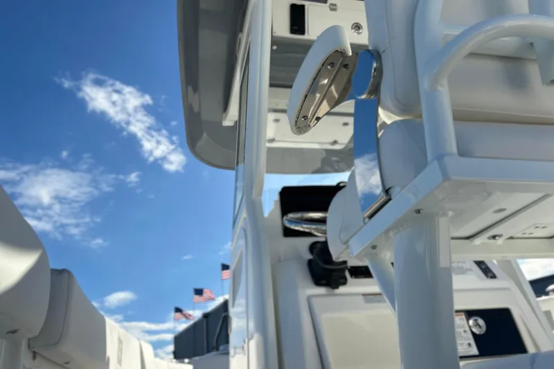 Slide: The Image of 2026 Sea Fox 268 Commander boat interior with blue sky and American flags. - 26