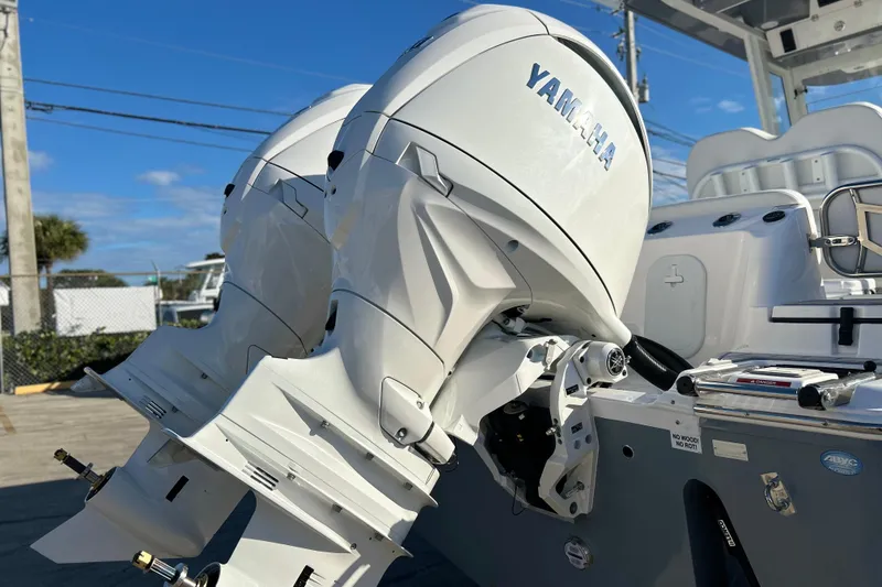 Slide: The Image of 2026 Sea Fox 268 Commander with dual Yamaha outboard engines, docked under clear skies. - 40