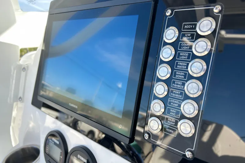 Slide: The Image of 2026 Sea Fox 268 Commander dashboard with Garmin display and control panel. - 5