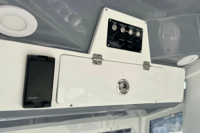 Slide: The Image of 2026 Sea Fox 268 Commander dashboard with control panel and storage compartment. - 8