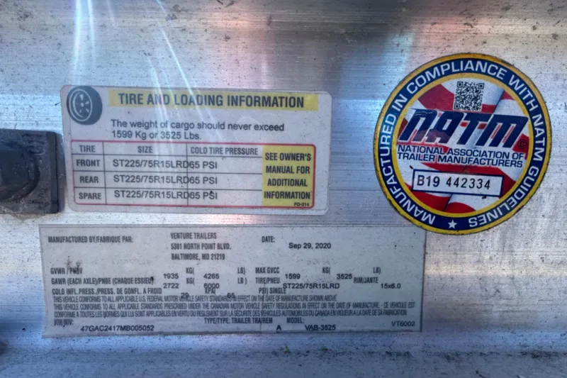 Slide: The Image of Tire and loading information label on a 2020 Clearwater 2000 Center Console boat. - 105