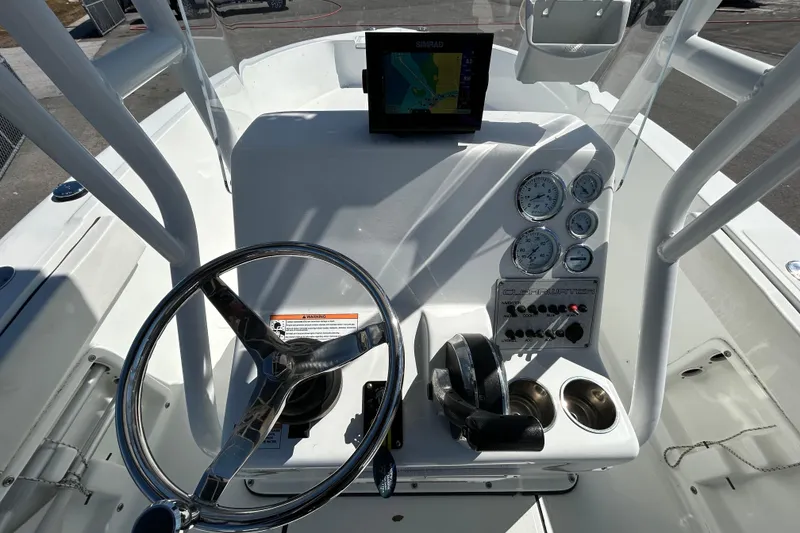 Slide: The Image of Center console of 2020 Clearwater 2000 boat with steering wheel and navigation display. - 15