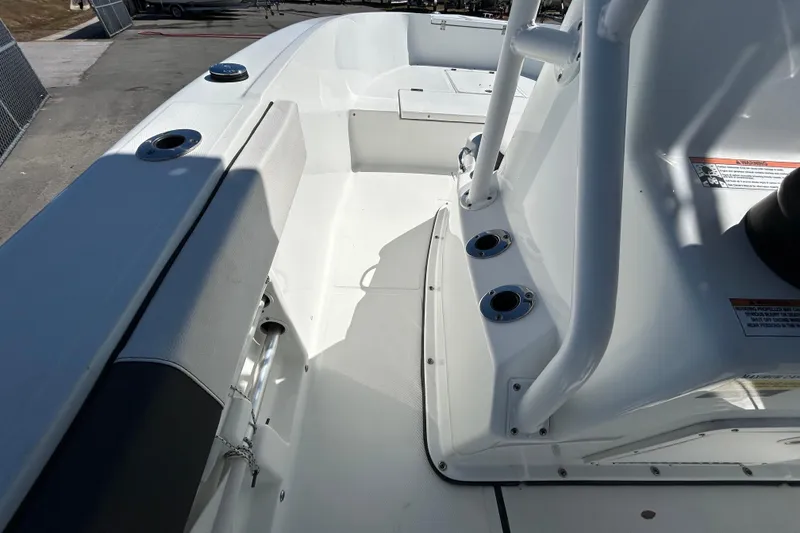 Slide: The Image of 2020 Clearwater 2000 Center Console boat interior with seating and rod holders. - 16
