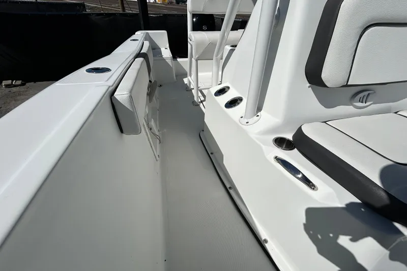 Slide: The Image of 2020 Clearwater 2000 Center Console boat interior with seating and cup holders. - 26